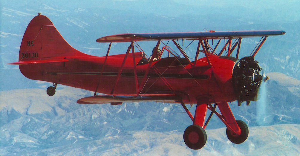 Jack Race flying Red Waco open-cockpit biplane