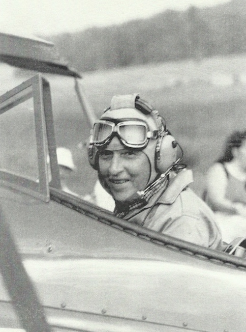 Jack Race in open cockpit bi-plane